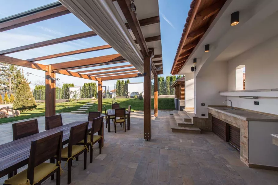 canopy-over-outdoor-patio-against-blue-sky